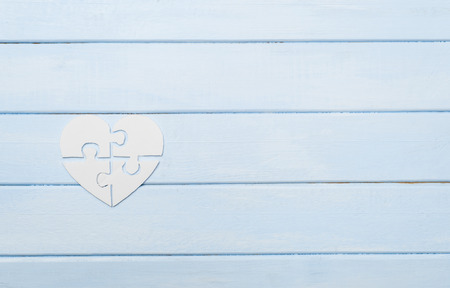 White heart made of symbolic autism puzzle piecesの写真素材