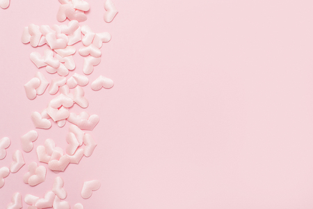 Elements in shape of heart flying on pink background. symbols of love for Happy Women's, Mother's, Valentine's Dayの写真素材