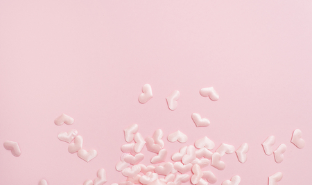 Elements in shape of heart flying on pink background. symbols of love for Happy Women's, Mother's, Valentine's Dayの写真素材