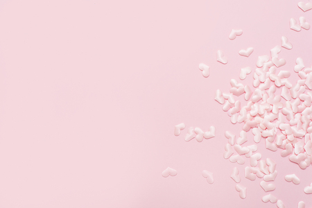 Elements in shape of heart flying on pink background. symbols of love for Happy Women's, Mother's, Valentine's Dayの写真素材