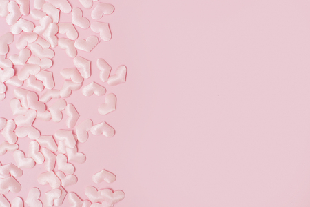 Elements in shape of heart flying on pink background. symbols of love for Happy Women's, Mother's, Valentine's Dayの写真素材