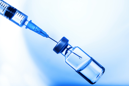 Medical concept Vaccination vaccine vial dose flu shot drug needle syringeの写真素材