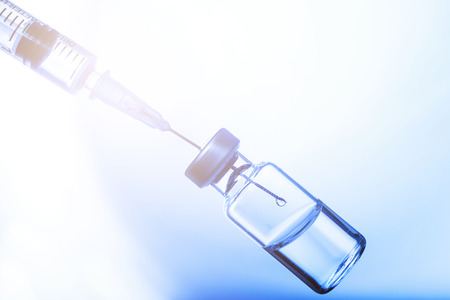 Medical concept Vaccination vaccine vial dose flu shot drug needle syringeの写真素材