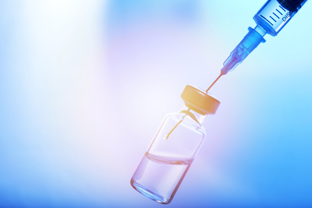 Medical concept Vaccination vaccine vial dose flu shot drug needle syringeの写真素材