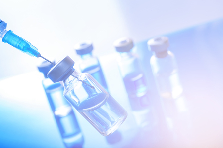 Medical concept Vaccination vaccine vial dose flu shot drug needle syringeの写真素材