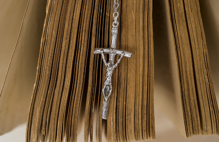 holy bible with rosary beads on wooden backgroundの写真素材