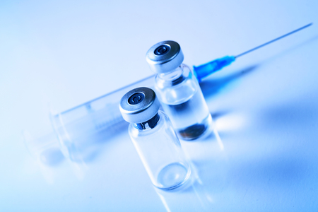 Medical concept Vaccination vaccine vial dose flu shot drug needle syringeの写真素材