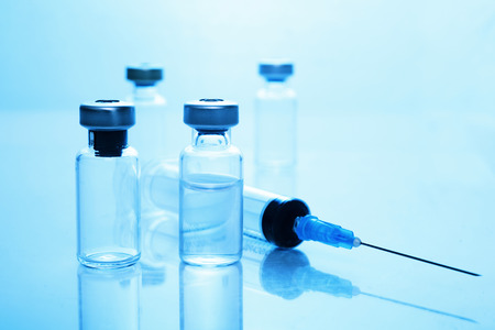 Medical concept Vaccination vaccine vial dose flu shot drug needle syringeの写真素材