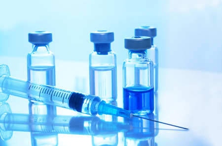 Medical concept Vaccination vaccine vial dose flu shot drug needle syringeの写真素材
