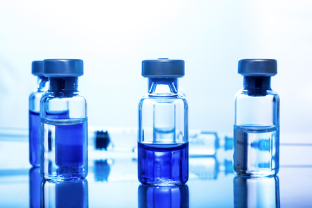 Medical concept Vaccination vaccine vial dose flu shot drug needle syringeの写真素材