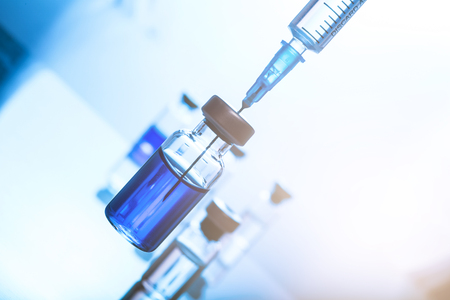 Medical concept Vaccination vaccine vial dose flu shot drug needle syringeの写真素材