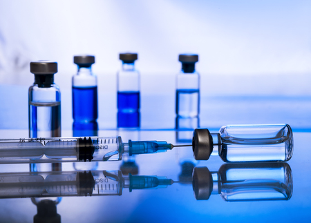Medical concept Vaccination vaccine vial dose flu shot drug needle syringeの写真素材