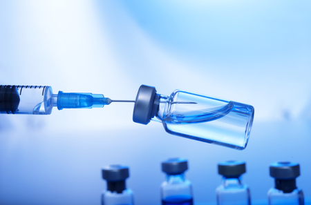 Medical concept Vaccination vaccine vial dose flu shot drug needle syringeの写真素材