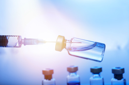 Medical concept Vaccination vaccine vial dose flu shot drug needle syringeの写真素材