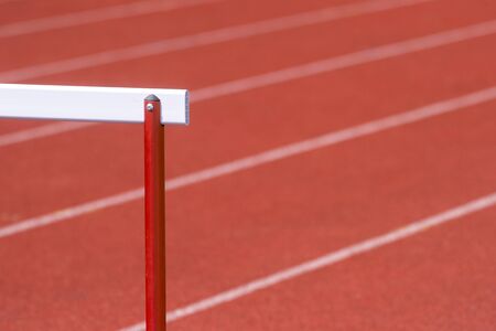 hurdle on the red running track prepared for competitionの写真素材