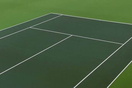 White lines of tennis courts on green floor background and have copy space for design backdrop in your workの写真素材