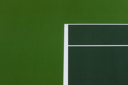 White lines of tennis courts on green floor background and have copy space for design backdrop in your workの写真素材
