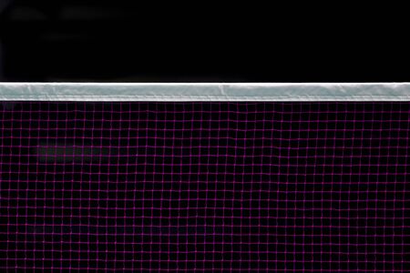 Badminton net indoor on badminton court, closeup view of badminton net with black backgroundの写真素材