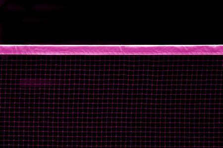 Badminton pink net indoor on badminton court, closeup view of badminton net with black backgroundの写真素材