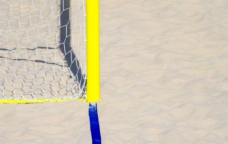 football summer sport. closeup goal net on a sandy beach outdoorの写真素材
