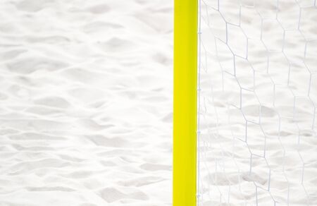 football summer sport. closeup goal net on a sandy beach outdoorの写真素材