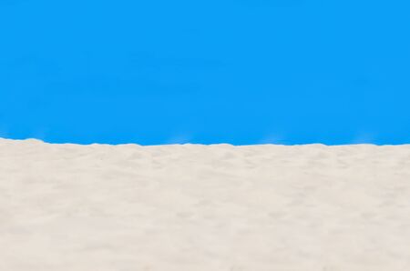 Football, volleyball, handball summer sport. Sandy beach on blue background with copy space for textの写真素材