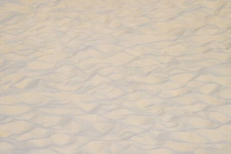 closeup of sand pattern of a beach in the summerの写真素材