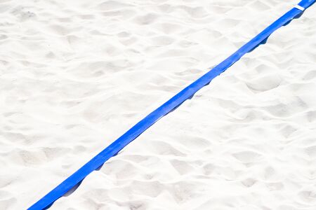 beach volleyball, soccer, handball court up close and in detail with blue plastic line markerの写真素材
