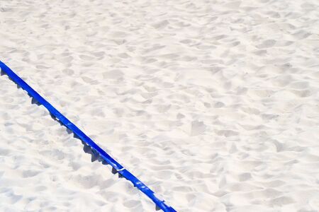 beach volleyball, soccer, handball court up close and in detail with blue plastic line markerの写真素材