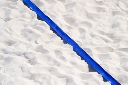 beach volleyball, soccer, handball court up close and in detail with blue plastic line markerの写真素材