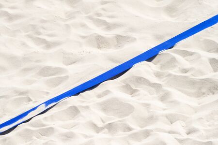 beach volleyball, soccer, handball court up close and in detail with blue plastic line markerの写真素材