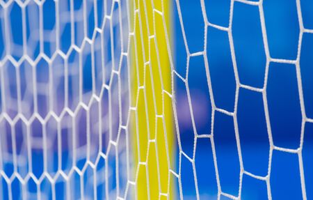 football summer sport. closeup goal net on a sandy beach outdoorの写真素材