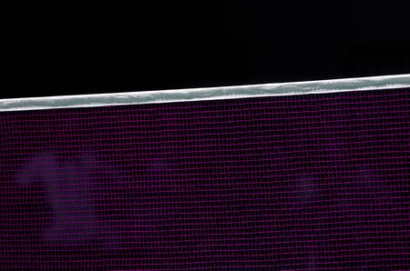 Badminton net indoor on badminton court, closeup view of badminton net with black backgroundの写真素材