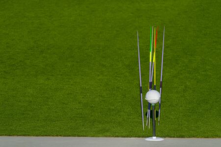 Colourful jevelin on grass background. Track and field.の写真素材