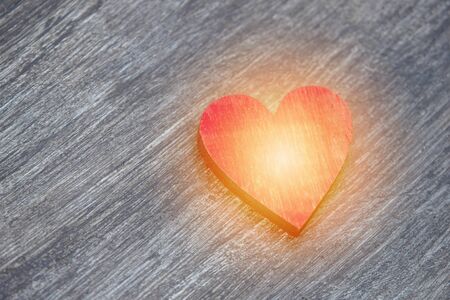 Red hearts on vintage wooden table top view. Saint Valentines day greeting card.の写真素材