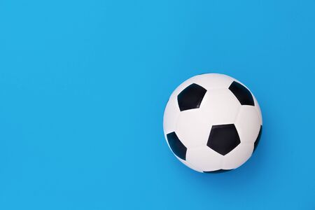Soccer ball or football on blue backgroundの写真素材