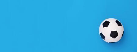 Soccer ball or football on blue backgroundの写真素材