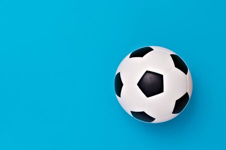 Soccer ball or football on blue backgroundの写真素材