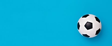Soccer ball or football on blue backgroundの写真素材
