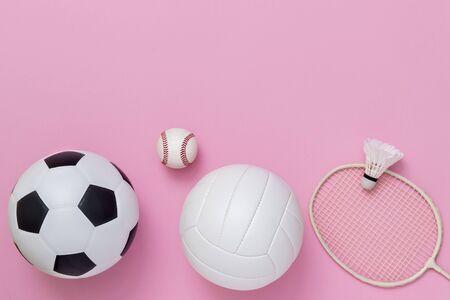 Assorted sports equipment on a pink background with copy spaceの写真素材