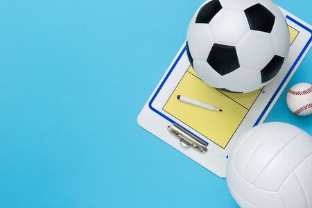 Assorted sports equipment on a blue background with copy spaceの写真素材