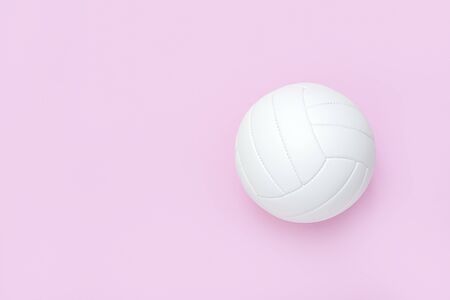 White volleyball leather ball on pink background. Top view.の写真素材