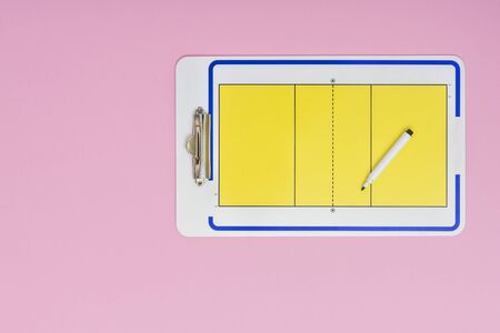 Volleyball tactical board with marker on pink background. Top viewの写真素材
