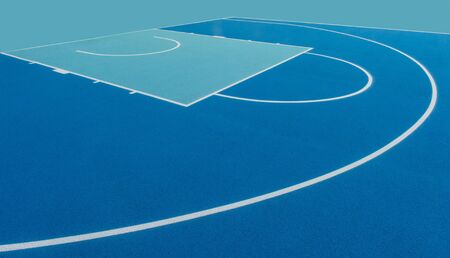 Abstract, blue background of newly made outdoor basketball court. Visible asphalt texture, freshly painted linesの写真素材