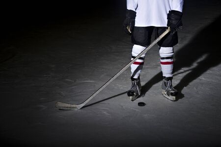 Hockey players legs close-up during a game on iceの写真素材
