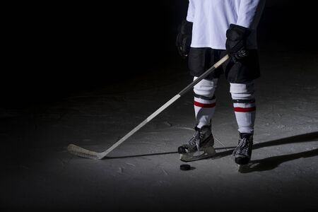 Hockey players legs close-up during a game on iceの写真素材