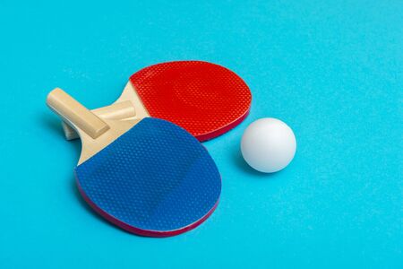 Two rackets for playing table tennis on blue backgroundの写真素材