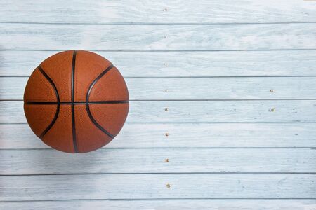 A basketball on the wooden floor as backgroundの写真素材