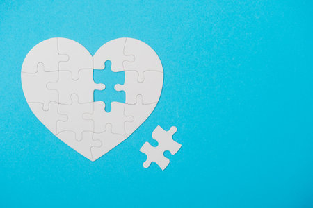 White Puzzle Heart Shape With Missing Piece, On Blue