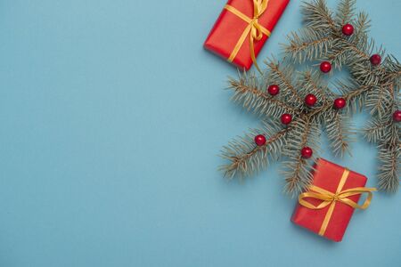 Christmas gift boxes with decoration on blue background.の写真素材
